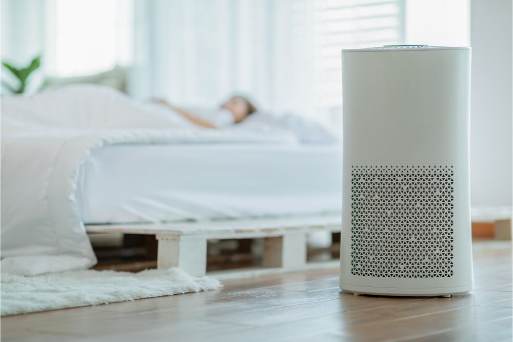 woman sleep with Air purifier in cozy white bedroom